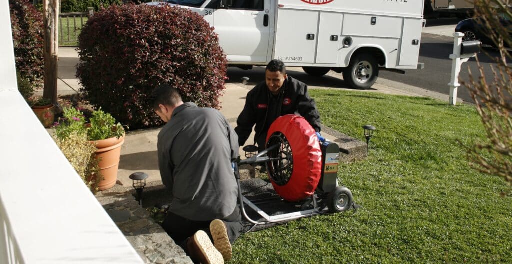 gotelli plumbing technicians performing a plumbing service in a california home